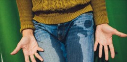 Leady having urinary incontinence wearing jeans and a jumper