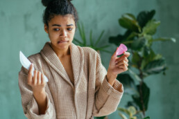 Young woman confused about what period products to use.