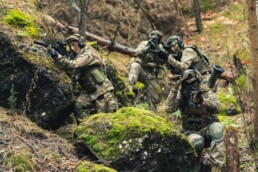 UK military male and female personnel on operations with weapons